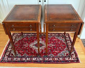 J159 - $150. Pair Of Vintage Drop-Leaf Side Tables with Leather Tops and Brass Wheels. Measures 43" W x 17" W x 27.25" Tall. Each Leaf measures 8.5" W.