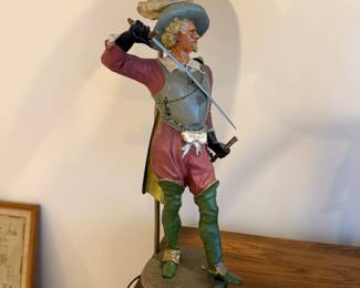 J115 - $175. Pair of Musketeer Cast Iron Lamps. Heavy! Shades are in good condition. Measures 35" Tall.