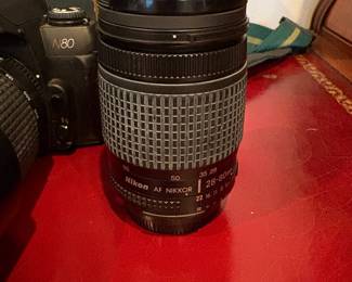J57 - $150. Nikon N80 Camera. AF Nikkor 70 - 300 mm Lens. Nikkor 28 - 80 mm Lens. Camera is untested.