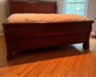 J132 - $350. King Sleigh Bed by Pulaski Furniture. Clean Mattress & Box Spring included if you want them! Measures 81" W x 88" L x 62" Tall.