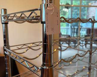 J114 - $35. Metal Wine Rack. Measures 35" w x 14" D x 44.5" Tall.