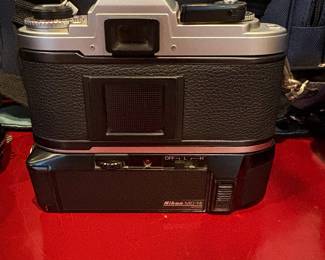J58 - $120. Nikkon FG 35mm SLR Film Camera. Lens and Accessory Lot. Camera is untested.