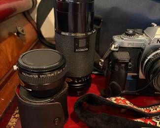 J58 - $120. Nikkon FG 35mm SLR Film Camera. Lens and Accessory Lot. Camera is untested.