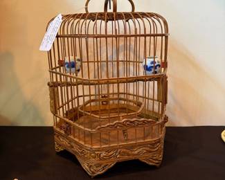J110 - $60. Antique Chinese Bird Cage with Porcelain Seed and Water Bowls. Measures 10" Hex x 16" Tall.