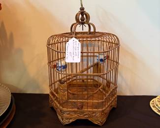 J110 - $60. Antique Chinese Bird Cage with Porcelain Seed and Water Bowls. Measures 10" Hex x 16" Tall.