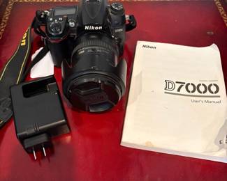 J56 - $180. Nikon D7000 Camera. Alikon DX SMW VR ED Aspherical 72 Lense. Powers on and looks to be in working order.