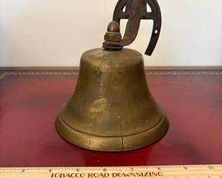 J15 - $20. Wall Mount Brass Bell with Horse-shoe Hanger. The bell has a crack.