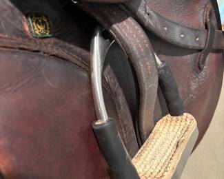J101 - $500. Stubben Roxane Saddle with Stand. 17.5" seat. 31 cm tree. Serial # 2949956. Made in Switzerland. Light cracking and some discoloration on the seat. Includes 54" leather girth, Lami-Cell gel saddle pad & Metal Rack.