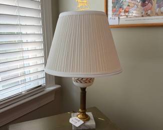 J140 - $50. Marble Base Milk Glass with Gold Leaf Design Lamp with an Equestrian Finial. Measures 19” Tall.