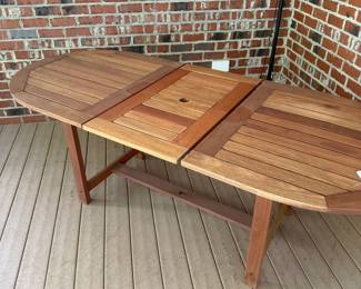 J36 - $400. Teak Patio Table. Measures 63" long x 35.5" wide + 19.5" butterfly leaf. Overall very good condition - has been used on a covered, screened in porch.