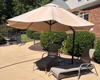 J69 - $100. Adjustable Patio Umbrella & Stand. Umbrella has some sun fading but otherwise in good condition.