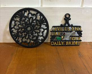107 pairofcastirondecorativetrivets