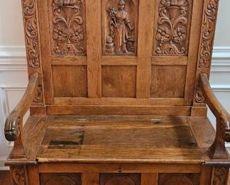 ANTIQUE CARVED OAK HALL BENCH / SETTEE — Beautifully crafted solid oak bench featuring extensive hand-carved floral, scroll and figural details, paneled back and seat, carved arms and turned feet. A striking statement piece with exceptional craftsmanship and character.