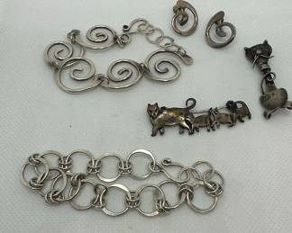 Collection of Sterling Silver Jewelry with Cat Motifs and Spiral Links