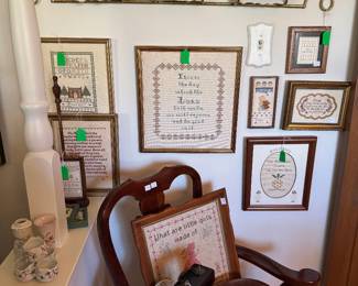 Assortment of framed needlepoint throughout home