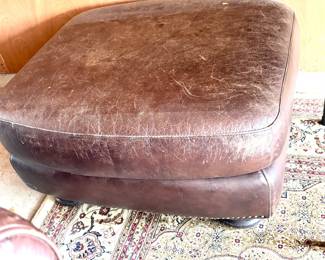 Distressed leather ottoman