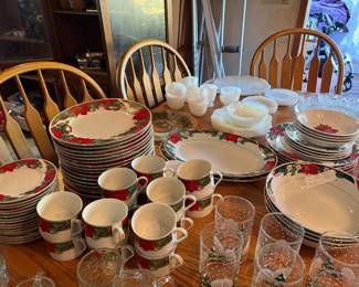 Holiday table settings, along with white and clear glass settings (back of photo). This is also the oak dining set for salem with 8 chairs.