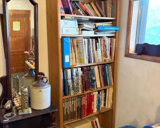 Books, magazines, bookshelf, Hall table with mirror, antique jug.