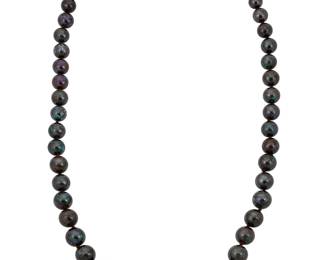 175 Tiffany & Co.: A Platinum and Koroit Opal Necklace Featuring graduated Koroit opal beads measuring approximately 7.01 -14.90 mm, finished with a single marquise-shaped diamond weighing approximately 0.75 carat, signed Tiffany & Co. Length: 22 1/2 in. 72.5 grams gross Estimate: $7,000 - $10,000