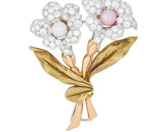 71 A Bi-Color Gold, Platinum, Pearl and Diamond Brooch Of a floral bouquet design, featuring leaves and stems of rose and yellow gold, topped with flowers of platinum centering a white and pink pearl finished with round diamonds weighing approximately 1.75 carats Measures: 1 7/8 x 1 1/4 in. 12.8 grams gross Estimate: $3,000 - $5,000
