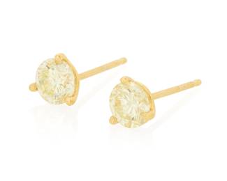 292 A Pair of 14K Gold and Diamond Stud Earrings Centering two round diamonds weighing 1.06 carats total 2 pieces Measures: 1/4 in. 1.1 grams gross Estimate: $600 - $800