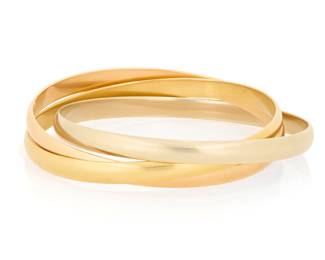 73 Cartier: An 18K Tri-Color Gold ‘Trinity de Cartier' Bracelet Featuring three interlocking bangles of yellow, white and rose gold, signed Cartier, 738530, 64, with original box and papers Inner Circumference: 8 in. 87.6 grams gross Estimate: $7,000 - $9,000