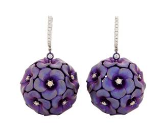 174 Alexis NY: A Pair of 18K White Gold, Titanium and Diamond Earrings Of a spherical design featuring blossoming flower motifs centering round brown diamonds weighing approximately 0.95 carats, signed Alexis NY 2 pieces Measures: 1 1/4 x 7/8 in. 14.4 grams gross Estimate: $2,500 - $3,500