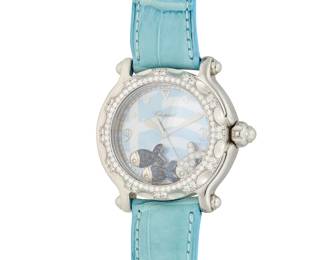 316 Chopard: A Stainless-Steel and Diamond 'Happy Hellas' Watch Dial: 25.00 mm, round Greek flag with mother-of-pearl and Diver hour markers, featuring floating happy fish Case: 35.00 Case number: 1050403, ref. 28/8421-20 Closure: blue leather strap with stainless-steel buckle clasp Signed: dial, case and strap Inner circumference: 6 1/2 - 8 in. 70.3 grams gross Estimate: $6,000 - $8,000