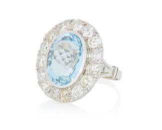 112 A 14K White Gold, Aquamarine and Diamond Ring Centering an oval aquamarine weighing approximately 9.29 carats, encircled by old mine-cut diamonds weighing approximately 2.90 carats Size: 6 1/4 9.8 grams gross Estimate: $2,500 - $3,500
