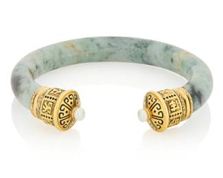 20 Cartier: An 18K Gold and Jade Cuff Featuring pagoda inspired terminals, accented by two cultured pearls and scrolling motifs of black enamel, signed Cartier with French assay marks Inner circumference: 6 7/8 in., Gap: 1 in. 68.2 grams gross Estimate: $4,500 - $6,500