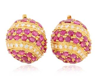 55 A Pair of 14K Gold, Ruby and Diamond Earrings Of a domed design featuring alternating bands of oval ruby cabochons, accented by round diamonds weighing approximately 1.65 carats 2 pieces Measures: 1 x 7/8 in. 21.8 grams gross Estimate: $3,500 - $5,500