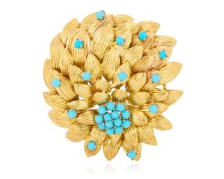 276 An 18K Gold and Turquoise Glass Brooch Of a floral design featuring textured overlapping leaves accented by round turquoise glass cabochons Measures: 1 7/8 in. 34.4 grams gross Estimate: $3,000 - $5,000
