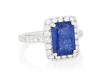 176 A Platinum, Sapphire and Diamond Ring Centering an emerald-cut sapphire weighing approximately 4.16 carats, accented by round diamonds weighing approximately 0.80 carats Size: 6 3/4 6.7 grams gross Accompanied by a GIA Report numbered #2231722971, dated October 1,2025, stating the Sapphire as natural Corundum of Sri Lankan origin with heat enhancement. Estimate: $3,000 - $5,000