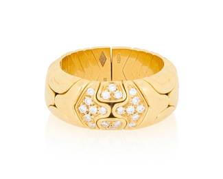 96 Bulgari: An 18K Gold and Diamond 'Parentesi' Ring Of an open flexible design featuring interlocking high polish gold elements accented by round diamonds, signed Bulgari with Italian workshop marks Size: 7 12.4 grams gross Estimate: $4,000 - $6,000