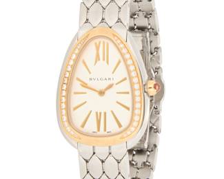 313 Bulgari: A Stainless-Steel and Rose Gold 'Serepenti Seduttori' Watch Dial: 18.70 mm, snake head dial, with baton and roman numeral hour markers Case: 26.50 mm Case number: 1NIXJ3 Closure: scale link bracelet with butterfly clasp Signed: dial, case and clasp, with booklet Inner circumference: 6 3/4 in. 64.7 grams gross Estimate: $8,000 - $12,000