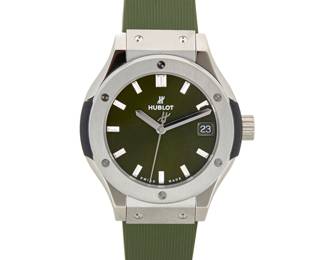 321 Hublot: A Stainless-Steel 'Classic Fusion' Watch Dial: 22.50 mm, round titanium green dial with baton hour markers Case: 30.00 mm Case number: 1661667 Closure: rubber bracelet with deployment clasp Signed: dial, case and clasp, with original box Inner circumference: 5 1/2 - 6 3/4 in. 38.6 grams gross Estimate: $4,000 - $6,000