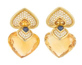 219 A Pair of 18K Gold, Gem-Set and Diamond Earrings Featuring faceted hear-shaped citrines, mirrored by a heart-shaped design set with citrine, sapphire cabochons and round diamonds, signed alentE partial mark, with Italian workshop marks 2 pieces Measures: 1 3/4 x 1 in. 39.8 grams gross Estimate: $5,000 - $7,000
