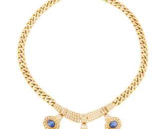 266 An 18K Gold, Sapphire, and Diamond Necklace Featuring a Cuban link chain centering diamond set links suspending three oval sapphire double cabochons, estimated total diamond weight 2.75 carats Length: 14 in. 72.7 grams gross Estimate: $12,000 - $18,000