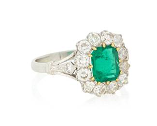 227 A Platinum, Emerald and Diamond Ring Centering an octagonal-cut emerald weighing approximately 1.44 carats, encircled by twelve old mine-cut diamond weighing approximately 1.45 carats Size: 6 3/4 in. 4.4 grams gross Accompanied by GIA report Estimate: $3,500 - $5,500