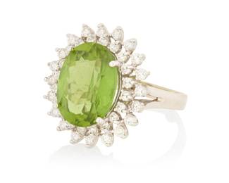 105 A 14K White Gold, Peridot and Diamond Ring Centering an oval peridot weighing approximately 10.35 carats, encircled by two rows of round diamonds weighing approximately 1.20 carats Size: 8 3/4 10.9 grams gross Estimate: $1,800 - $2,500