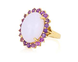 78 A 14K Gold, Lavender Jade and Amethyst Ring Centering an oval lavender jade cabochon weighing approximately 21.32 carats, encircled by round amethysts Size: 9 1/4 14.0 grams gross Accompanied by a Mason-Kay Report numbered #260303-1400, dated April 3, 2026, stating the jade as natural jadeite with no dye or impregnation detected - 'A' jade. Estimate: $2,000 - $3,000