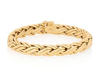 151 Tiffany & Co.: A 14K Gold Bracelet Of a fancy braided link design, signed Tiffany & Co., with signed box Length: 7 3/4 in., Width: 3/8 in. 24.3 grams gross Estimate: $3,000 - $5,000