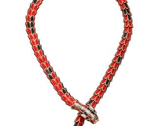 86 Alexis NY: An 18K Rose Gold-Plated, Sterling Silver, and Enamel Necklace Of a dragon design featuring red and black enamel scales, accented by round diamonds and two marquise-shaped emeralds, signed Alexis NY Length: 13 - 20 in. 146.7 grams gross Estimate: $5,500 - $7,500