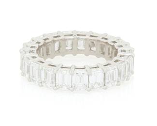 180 Tiffany & Co.: A Platinum and Diamond Eternity Ring Featuring twenty-one emerald-cut diamonds weighing approximately 5.25 carats, signed Tiffany & Co., 60407495, with signed box Size: 5 1/4 6.4 grams Estimate: $12,000 - $18,000