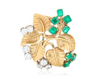 221 Seaman Schepps: A 14K Bi-Color Gold, Emerald and Diamond Flower Brooch Of a foliate design featuring eight emeralds accented by seven old European-cut diamonds weighing approximately 2.00 carats, signed Seaman Schepps Measures: 1 1/2 x 1 3/4 in. 16.2 grams gross Estimate: $4,000 - $6,000