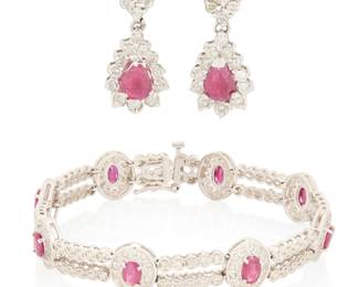 236 A 14K White Gold, Ruby and Diamond Bracelet and Earring Set Of an ornate motif centering oval and pear-shaped rubies weighing approximately 5.80 carats, accented by round and baguette diamonds weighing approximately 3.48 carats Bracelet: 7 3/8 in., Earrings: 1 1/8 in. 29.7 grams gross This lot is offered at no reserve. Estimate: $2,000 - $3,000