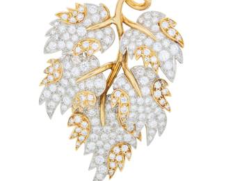 218 Schlumberger for Tiffany & Co.: An 18K Bi-Color Gold and Diamond Brooch Of a branch design featuring yellow and white gold leaves set with round diamonds weighing approximately 7.15 carats, signed Tiffany, Schlumbeger, with French assay marks Measures: 2 1/4 x 1 1/2 in. 23.8 grams gross Estimate: $12,000 - $18,000