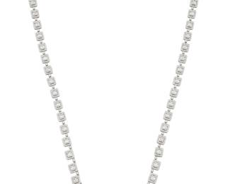 48 An 18K White Gold and Diamond Necklace Featuring rectangular links set with round and baguette diamonds weighing approximately 18.05 carats Length: 32 in. 69.3 grams gross Estimate: $18,000 - $25,000