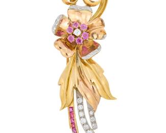 54 A Retro Tri-Color Gold, Diamond and Ruby Brooch Of a floral design featuring white, rose and yellow petals, accented by channel-set and round rubies, finished with transitional-cut and single-cut diamonds weighing approximately 0.90 carat Measures: 3 x 1 in. 21.2 grams gross Estimate: $2,800 - $3,500