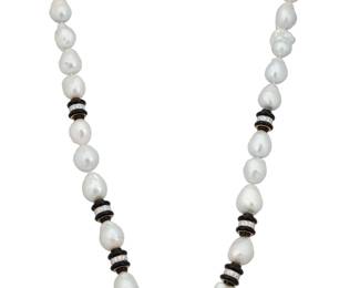 65 David Webb: An 18K Bi-Color Gold Baroque Pearl and Onyx Necklace Featuring baroque cultured pearls measuring approximately 13.2 - 20.7 mm, accidented by onyx rondelles accented by round diamonds weighing approximately 5.88 carats, signed David Webb Length: 33 in. 305.7 grams gross Estimate: $25,000 - $35,000